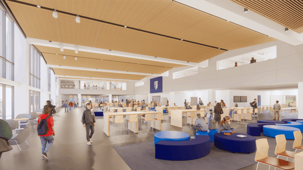 An architectural rendering of a large, modern university student union lobby featuring study areas, open seating, and people walking through the space.